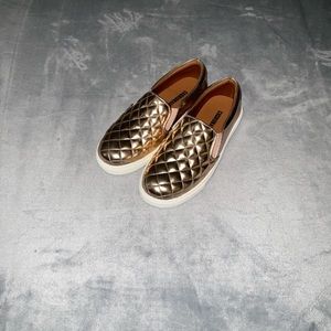 Gold slip on sneakers